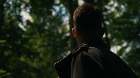Confused guy in the forest close up Stock Footage 118635871