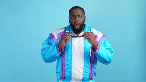 Confused guy impressed novelty isolated blue color background Video stock 167549535