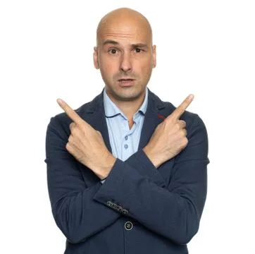 Confused guy pointing hands at different directions Stock Photos