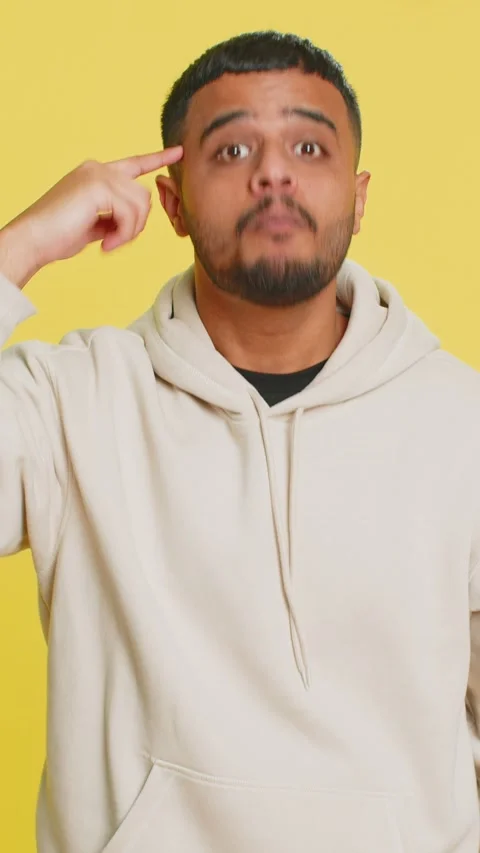 Confused Indian man pointing at camera showing stupid asking for insane crazy Stock Footage 320976712
