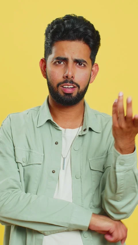 Confused Indian man pointing at camera showing stupid asking for insane crazy Stock Footage 323337496