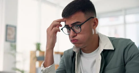 Confused, man and thinking in office with error, mistake or problem solving for Stock Footage 323999024