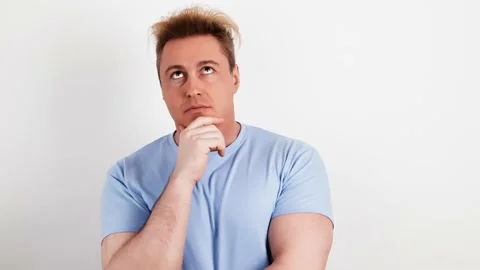 Confused man having doubt, thinking over choice, imagining plan, idea Stock Footage 238086716