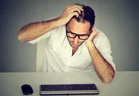 Confused man having problems with password Stock Photos