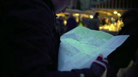 Confused man looking at paper map, checking route, direction to trip destination Stock Footage 67659037