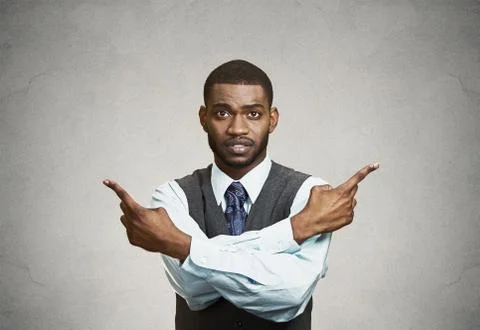 Confused man pointing in two different directions Stock Photos