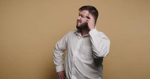 Confused man shows a range of expressions while pondering a difficult quest.. Stock-Footage 329110328