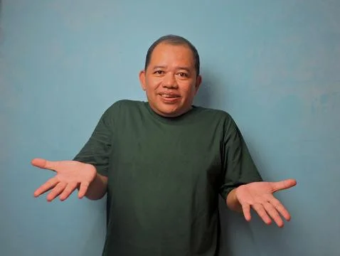 Confused Middle Aged Man Gesturing With Both Hands Stock Photos