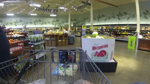 Confused Obese Man Pulling Shopping Cart in Vegetable Section Stock Footage 39096211