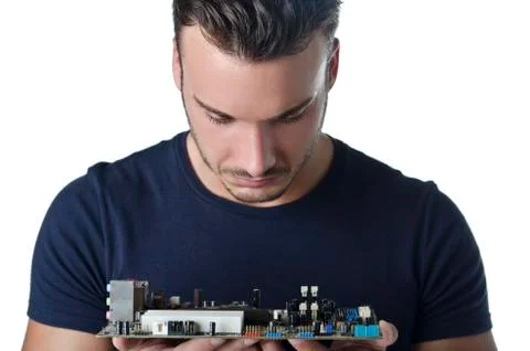Confused, puzzled computer technician looking at motherboard 스톡 사진