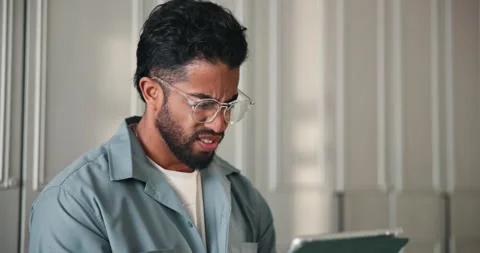 Confused, reading and tablet with man in home for streaming glitch, notification Stock Footage 318563198