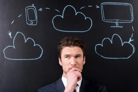 Confused smart developer man is thinking about project 写真素材