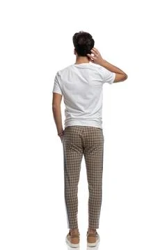 Confused young man scratching head and thinking of ways to solve problems Foto stock