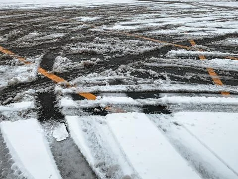 Confusion in parking lots after snow covers lines where cars go everywhere Stock Photos