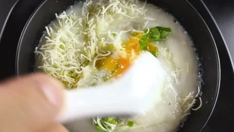 Congee with egg Video stock 337762738