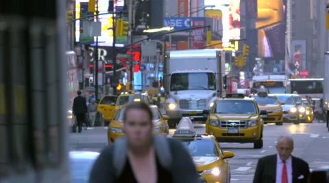 Congested busy street traffic cars people pedestrians Manhattan New York City NY Stock Footage