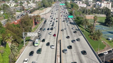 Congested Los Angeles highway car and truck traffic on day commute Stock Footage 273841570
