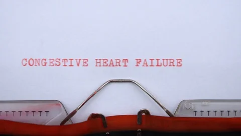 Congestive heart failure - phrase printed on an old typewriter in red letters Video stock 128399696