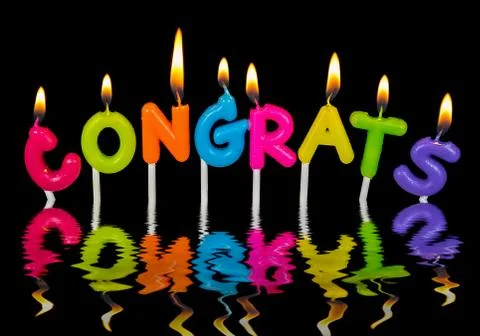 Congrats candle in water reflection Stock Photos