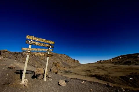 Congratulation-sign at the Stella Point at Mount Kilimanjaro Stock Photos