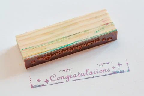 Congratulation stamped on paper Stock Photos