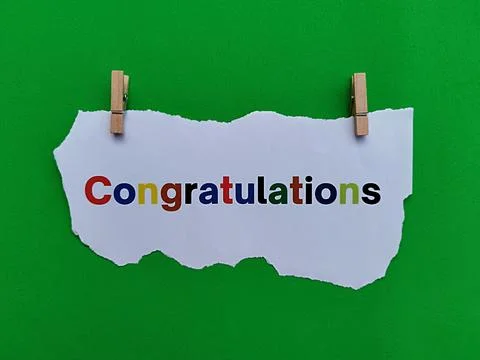 Congratulations text on torn paper with bright green background Stock Photos
