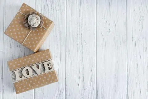 Congratulatory background with a two gift box and the inscription love. The b Stock Photos