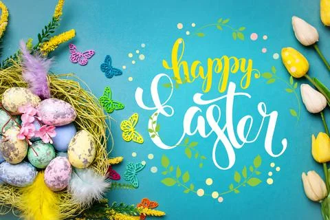 Congratulatory easter background. Easter eggs and flowers. Selective focus. Top Stock Photos
