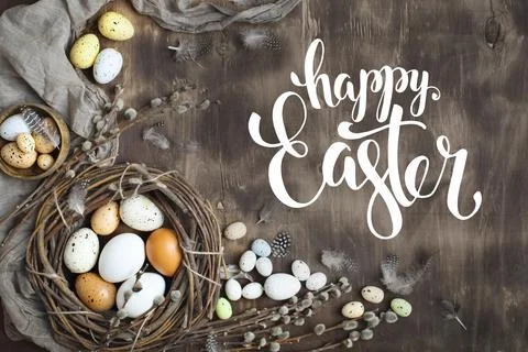 Congratulatory easter background. Easter eggs and flowers. Selective focus. Top Stock Photos