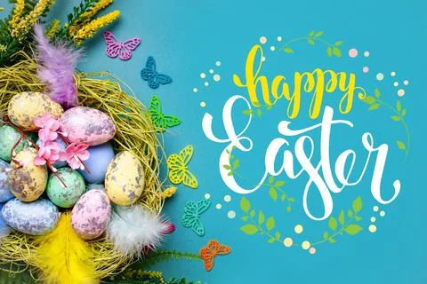 Congratulatory easter background. Easter eggs and flowers. Selective focus. Top Stock Photos