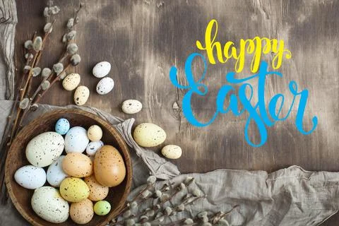 Congratulatory easter background. Easter eggs and flowers. Selective focus. Top Foto stock