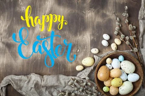 Congratulatory easter background. Easter eggs and flowers. Selective focus. Top Foto stock