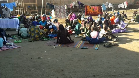 A Congregation Seated Outside  co Stock Footage 116624120
