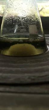 Conical flask containing yellow solution with sample build up at the bottom 库存照片