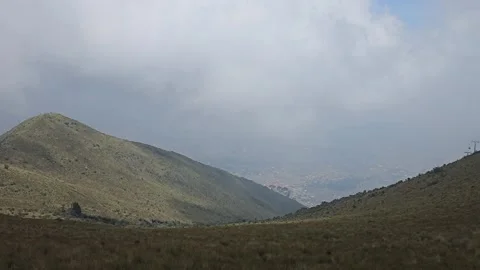 Conical Grassy Peak Above Cloud-Filled Valley, Cruz Loma, Quito, Ecuador 8K Stock Footage 331494442