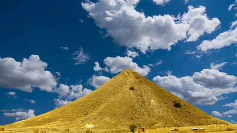 Conical mount top on a blue cloudy sky Stock Footage 152384314