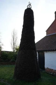 Conical Sculpture Of Interwoven Elements And Horseshoes In Scarrington, Stock Photos