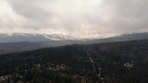 Coniferous forest in the background of snow-clad mountains, Uludag Stock Footage 133278390