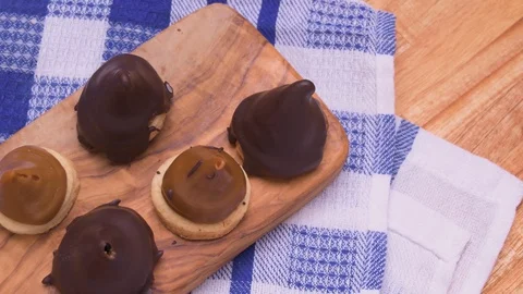 Conitos Dulce de Leche with Chocolate Sweet Cones on Wood Board on Blue Kitchen Video stock 129349302