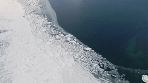 Conjunction of Frozen Ice Surface with Water in Winter. Aerial View Stock Footage 150615535