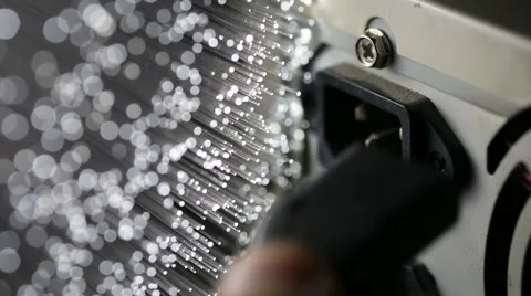 Connect and pull out electric cable into PC with Fiber optics background Stock Footage 66336924