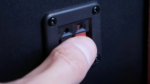 Connect the audio cable to the speaker Stockbeeldmateriaal 72436332
