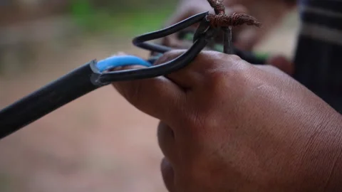 Connect the cable using pliers. Stock Footage 221732455