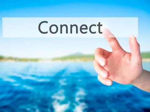 Connect - Hand pressing a button on blurred background concept on visual scre Stock Photos