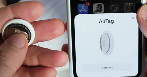 Connect pair setup[ AirTag after unboxing in iPhone Find my app Stock Footage 153401151