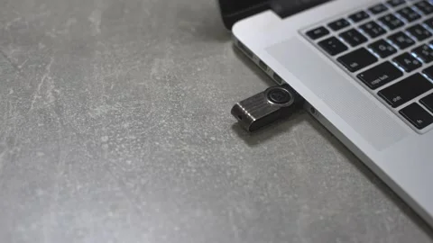 Connect a usb flash drive key to the port of a laptop pc computer. Stock Footage 146283291