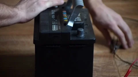 Connect the wires to the accumulator Video stock 35341847