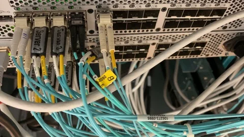 Connected Fiber Network Cable in a fiber channel network switch. Filmed in Stock Footage 111850299