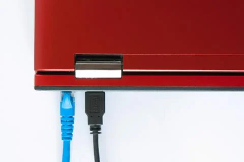Connected patch cable to laptop, plug with internet cable and laptop Stock Photos