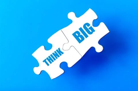 Connected puzzle pieces with text THINK BIG   Stock Illustration